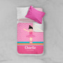 Spark & Spark Sweet Ballerina Sherpa Blanket, pink and white blanket with a ballet dancer illustration and the name Charlie, on a bed with white and pink pillows.