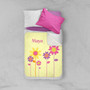 Spark & Spark Three Spring Blooms Sherpa Blanket, soft sherpa blanket with colorful flower design and personalized name May, on bed with pillows.