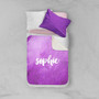 Spark & Spark Bold Colorful Name Purple Sherpa Blanket, personalized purple sherpa blanket with the name 'Sophie' printed on it, on a bed with pillows.