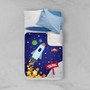 Spark & Spark Rocket Launch Sherpa Blanket, colorful space-themed children's blanket with a rocket, planets, stars, and the name 'Sean' on it, draped over a bed with pillows.