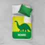 Spark & Spark Dino and Me - Green Sherpa Blanket, colorful dinosaur themed blanket with personalized name Richard, on a bed with white and green pillows.