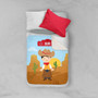 Spark & Spark Cowboy Sherpa Blanket, colorful kids' blanket featuring a cowboy theme with a cartoon cowboy character, desert scenery, cacti, and a blue sky, laid on a bed with a red pillow and white sheet.
