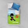 Spark & Spark Cool Super Ninja Sherpa Blanket, colorful blanket with a ninja character, mountains, and pagoda design on a child's bed.