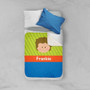 Spark & Spark Just Like Me Boy Green Sherpa Blanket, colorful children's blanket with a cartoon boy face and the name Frankie on it, spread on a bed with a white and blue pillow.