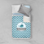 Spark & Spark Sweet Little Blue Whale Chevron Sherpa Blanket, personalized with the name Jackson, on a bed with pillows.