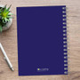 SparkGreetings® Simply Dots Writing Journal, blue spiral-bound notebook on wooden desk with a pen and a potted succulent plant