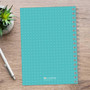 SparkGreetings® Mod Chevrons Writing Journal, blue dotted cover spiral-bound notebook on wooden desk with silver pen and green succulent plant.
