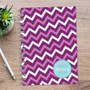 SparkGreetings® Mod Chevrons Writing Journal, purple chevron pattern with polka dots and a personalized blue name label on the cover.