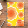 SparkGreetings® Pretty Blooms Writing Journal, vibrant yellow cover with orange and peach floral pattern and BMN logo.