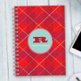 SparkGreetings® Criss Cross Writing Journal, red and pink plaid pattern with a personalized monogram and name on the cover.