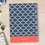 SparkGreetings® Simple Geometry Writing Journal, with a navy blue cover featuring a white geometric pattern and a coral-colored band at the bottom displaying the brand logo.