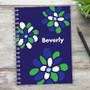 SparkGreetings® Stamped Blossoms Writing Journal, customized notebook with blue, white, and green flower design and the name Beverly printed on the cover.