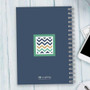 SparkGreetings® Blue Chevron Writing Journal, stylish notebook with a blue cover featuring a colorful chevron pattern in a square on the front.