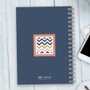 SparkGreetings® Blue Chevron Writing Journal, a navy blue spiral-bound notebook with a colorful chevron pattern on the cover.