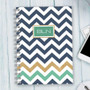 SparkGreetings® Blue Chevron Writing Journal, front view with navy, gold, and teal chevron pattern on the cover.