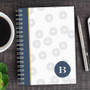 SparkGreetings® Spinning Circles Writing Journal, white journal with gray spiral pattern and a navy blue circle with the letter B on the cover.