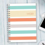 SparkGreetings® Array of Stripes Writing Journal, colorful striped cover design with pastel shades and the initials 'MGB' printed on it.