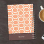 SparkGreetings® Tapestry Pattern Writing Journal, orange and white circular design on cover with a brown footer featuring the SparkGreetings logo and website.