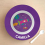 Spark & Spark Rocket Blast Kids Bowl, purple bowl with a space-themed design including a rocket, planet Earth, stars, and a flying saucer, with the name Camilla printed at the bottom and a white spoon placed beside it.
