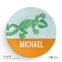 Spark & Spark Urban Gecko Kids Bowl, round plate featuring a green geometric gecko design on a light background with an orange band at the bottom displaying the name Michael.