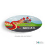 Spark & Spark Dragon Fire Personalized Boys Plate, colorful oval plate featuring a red dragon and a castle in a fantasy landscape with the name 'Michael' printed on it.