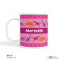 Spark & Spark Dinosaur Trails Girl Kids Placemat Mug with colorful dinosaur designs and the name Meredith written on it.
