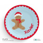 Spark & Spark Xmas Cookie Blue Kids Placemat with a gingerbread cookie character wearing a Santa hat and red scarf, and the name 'Xavier' written in red.