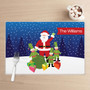 Spark & Spark Santa And Elfs Holiday Placemat, festive Christmas design with Santa Claus, elves, gifts, and snowy background.