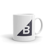 A white mug with the BigCommerce logo.