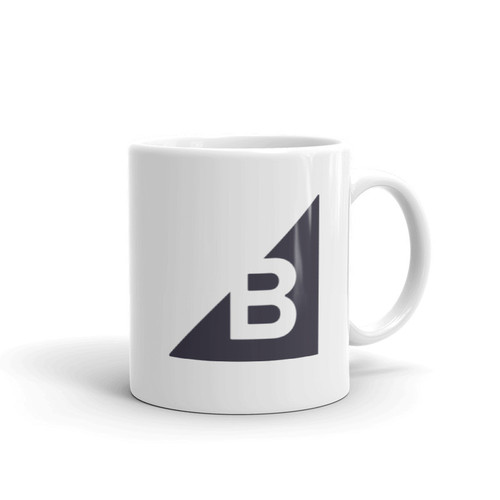 A white mug with the BigCommerce logo.