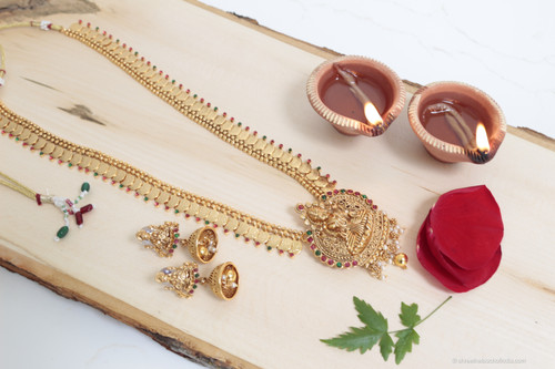 Goddess Lakshmi Pendant Embellished With Red And Green Stone And Coin Necklace With Matching Earrings