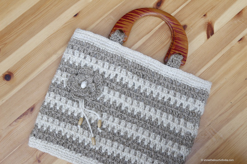 Elegant jute-brown and off white striped crochetted jute bag