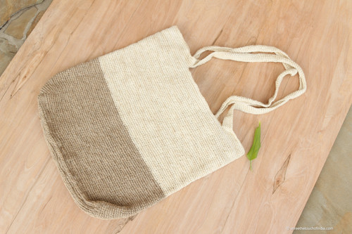 Jute-brown and off-white half-and-half zippered jute carry bag with long handles