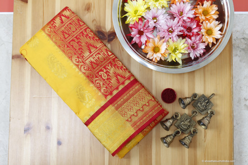 Exquisite red and mustard Kanchipuram silk saree with golden zari pallu