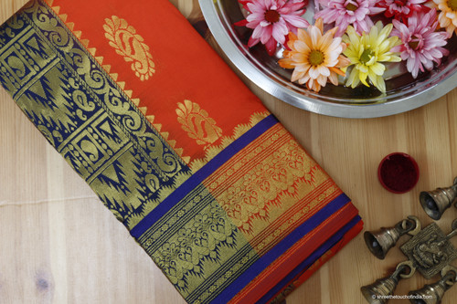 Orange and blue grand Kanchipuram silk saree with full intricate golden zari on a blue base