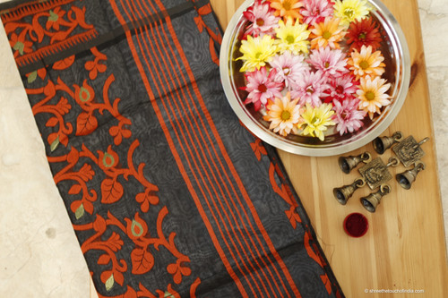 Black and orange cotton Jamdani saree with orange creeper design