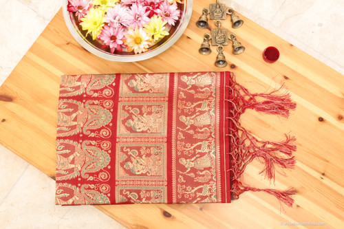Grand mesmerizing red and golden Baluchari Saree with a touch of green