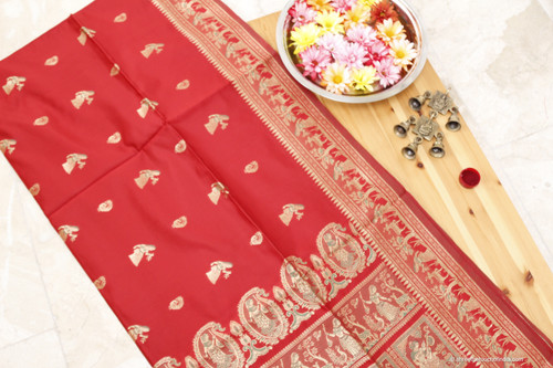 Grand mesmerizing red and golden Baluchari Saree with a touch of green