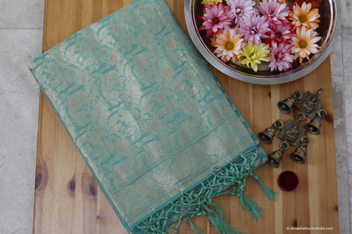 A ravishing pastel bluish green silk saree with fine silver zari