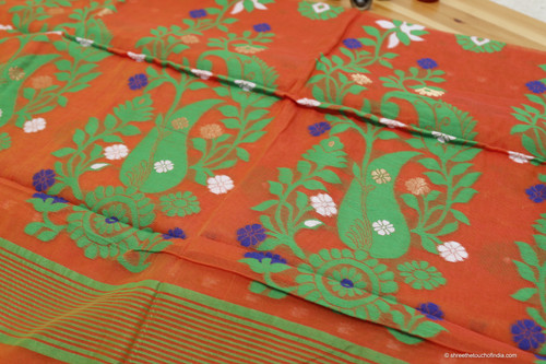 A dominant orange and green combination with sprinkled purple and white floral patterned  cotton Jamdani