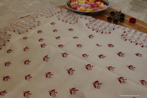 Deep red embroidered kantha stitch silk saree on an off white lustered base