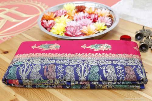 Grand mesmerizing red, blue and silver Baluchari Saree with a touch of green