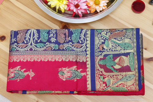 Grand mesmerizing red, blue and silver Baluchari Saree with a touch of green