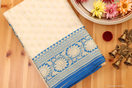 Luxurious white and blue regal Banarasi Katan silk saree with lush golden and silver zari