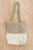 Jute-brown and off-white half-and-half zippered jute carry bag with long handles