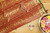 Grand red and golden zari silk saree with a green pallu embellished with zari