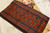 Black and orange cotton Jamdani saree with orange creeper design