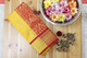 Exquisite red and mustard Kanchipuram silk saree with golden zari pallu