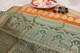 Orange and green soft silk saree with intricate golden zari