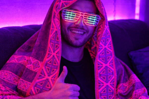 Light up the mainstage. Our UV Reactive Pashmina scarves bring vibrant, glowing geometry to every set.